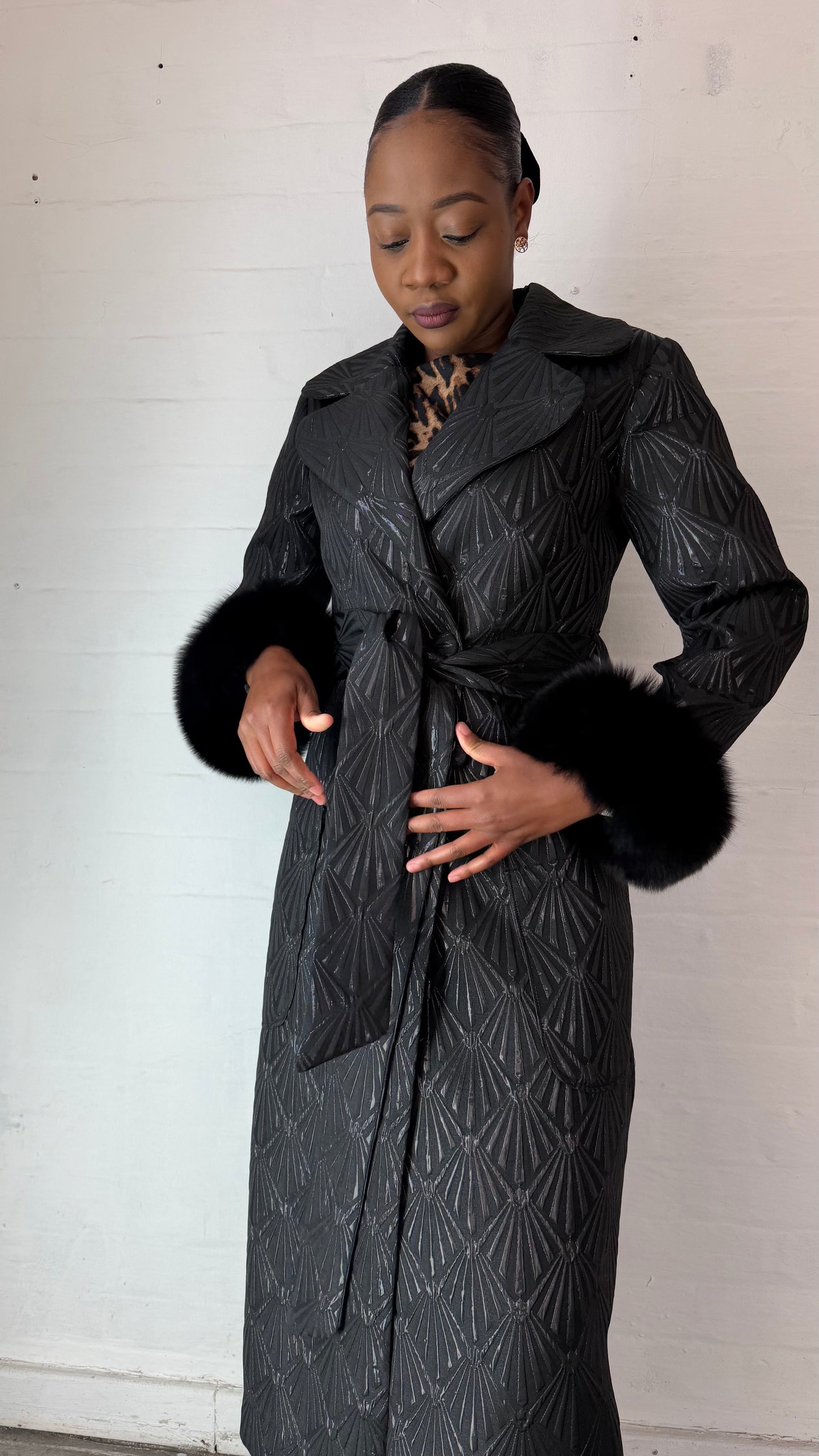 Black brocade coat by Thula Sindi