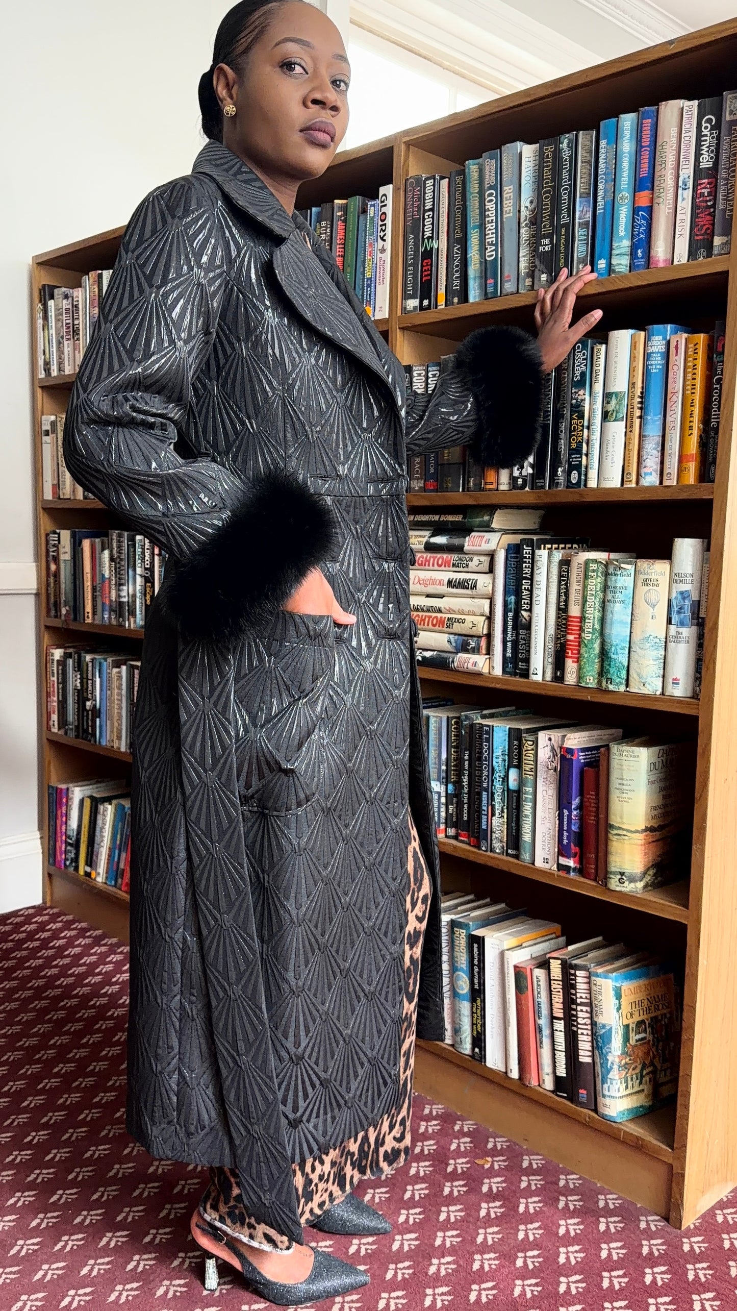 Black brocade coat by Thula Sindi