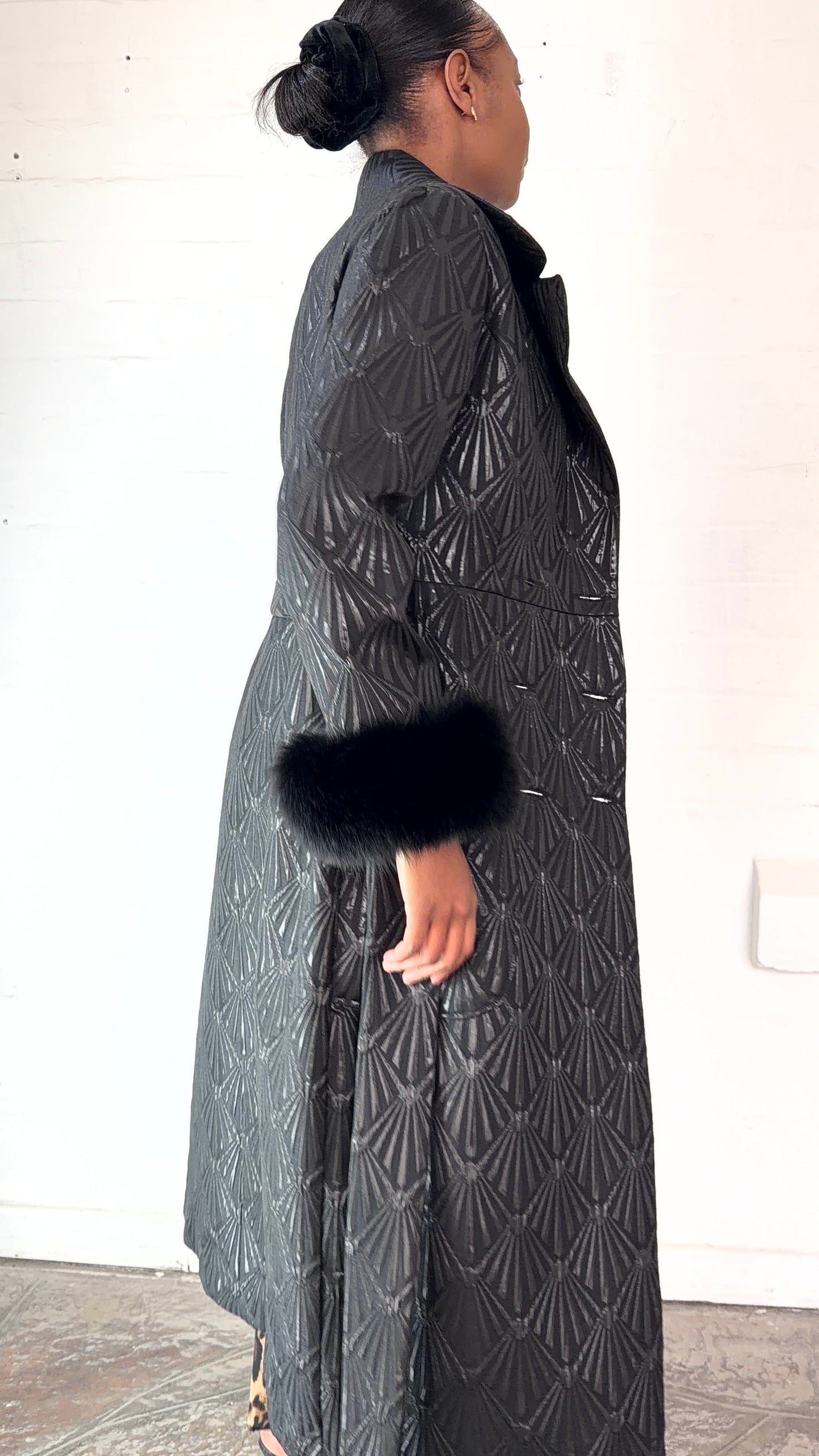 Black brocade coat by Thula Sindi