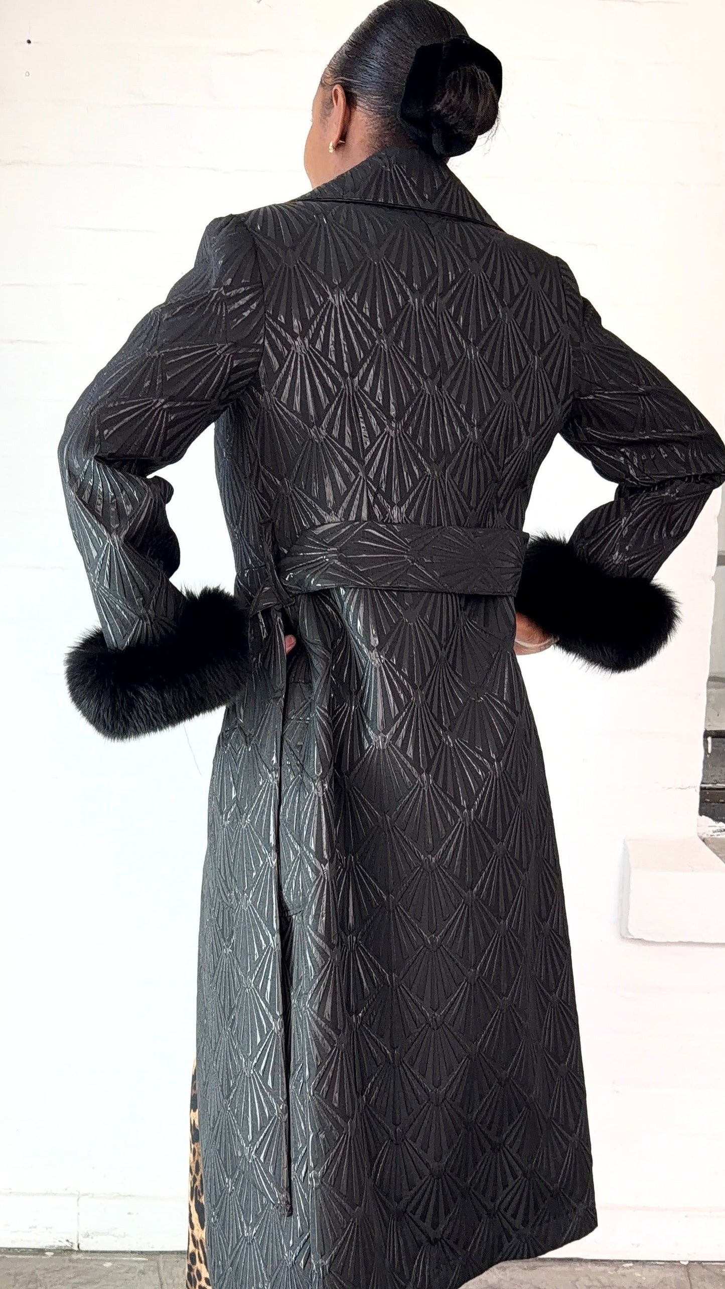 Black brocade coat by Thula Sindi