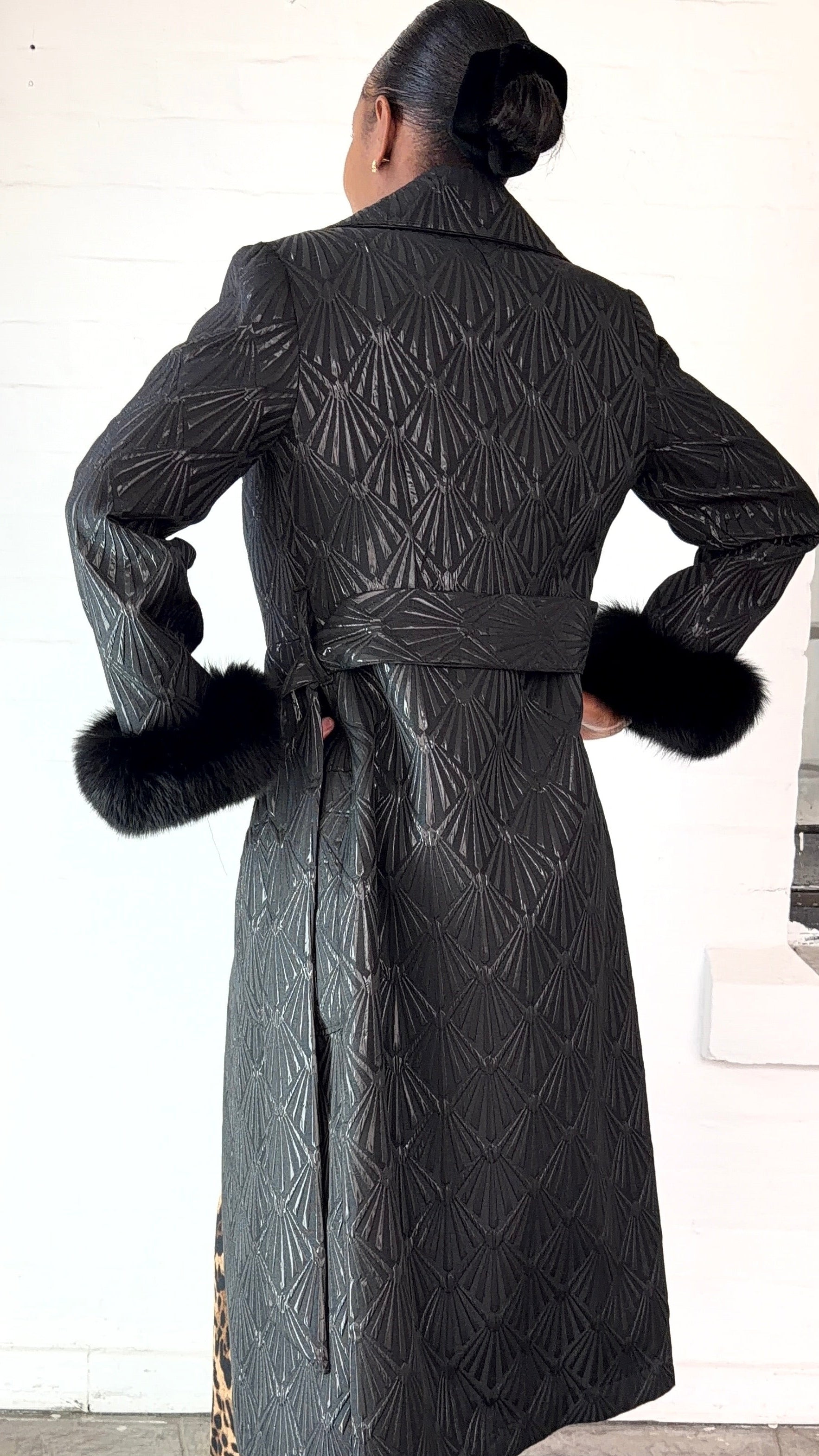 Black brocade coat by Thula Sindi